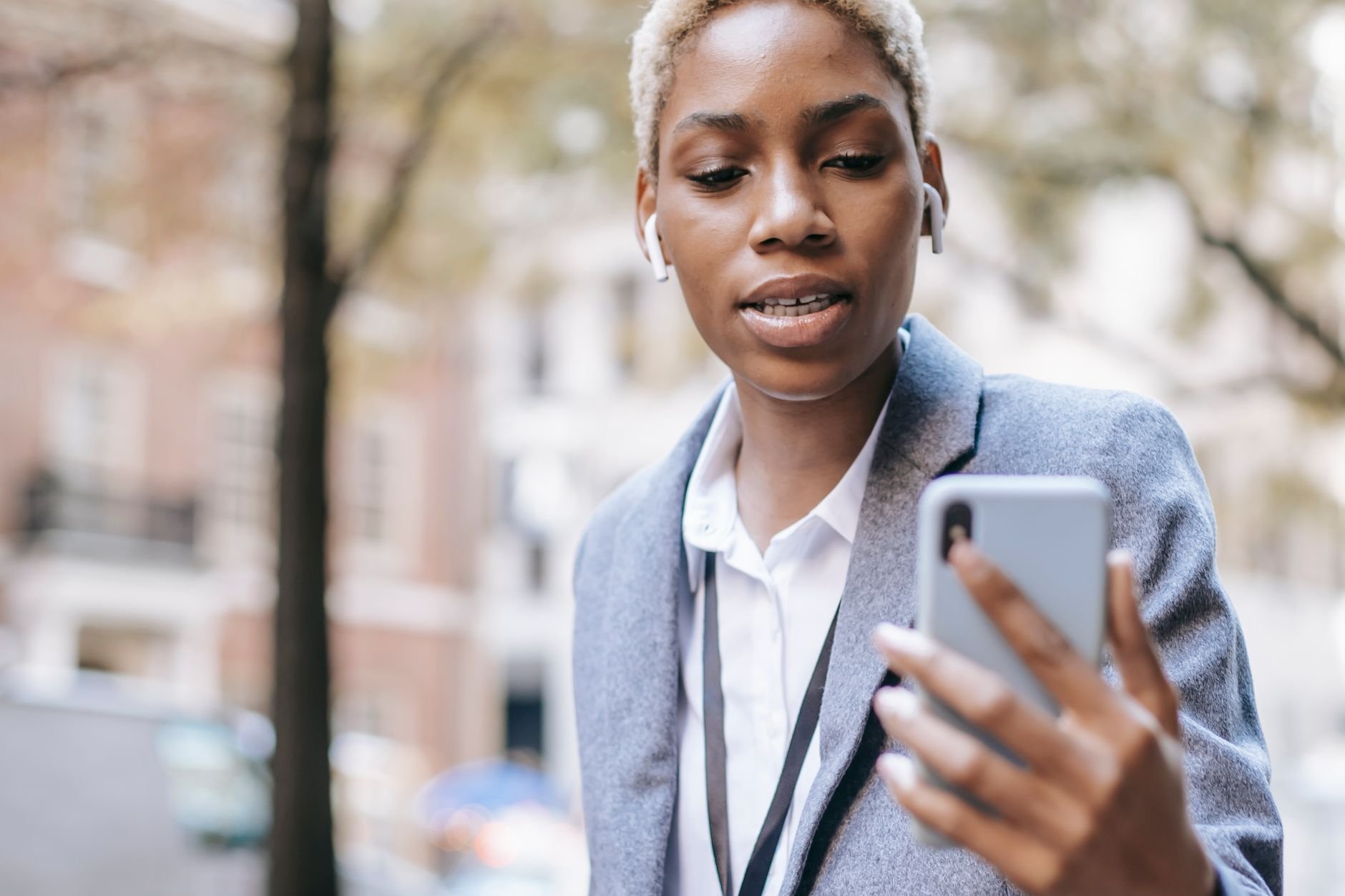 Business owner on smartphone managing WhatsApp messages